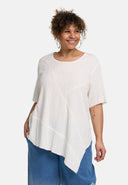 Túnaic 'Crissa' – plissiert, éadrom & nua-aimseartha-asiméadrach