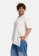 Túnaic 'Crissa' – plissiert, éadrom & nua-aimseartha-asiméadrach